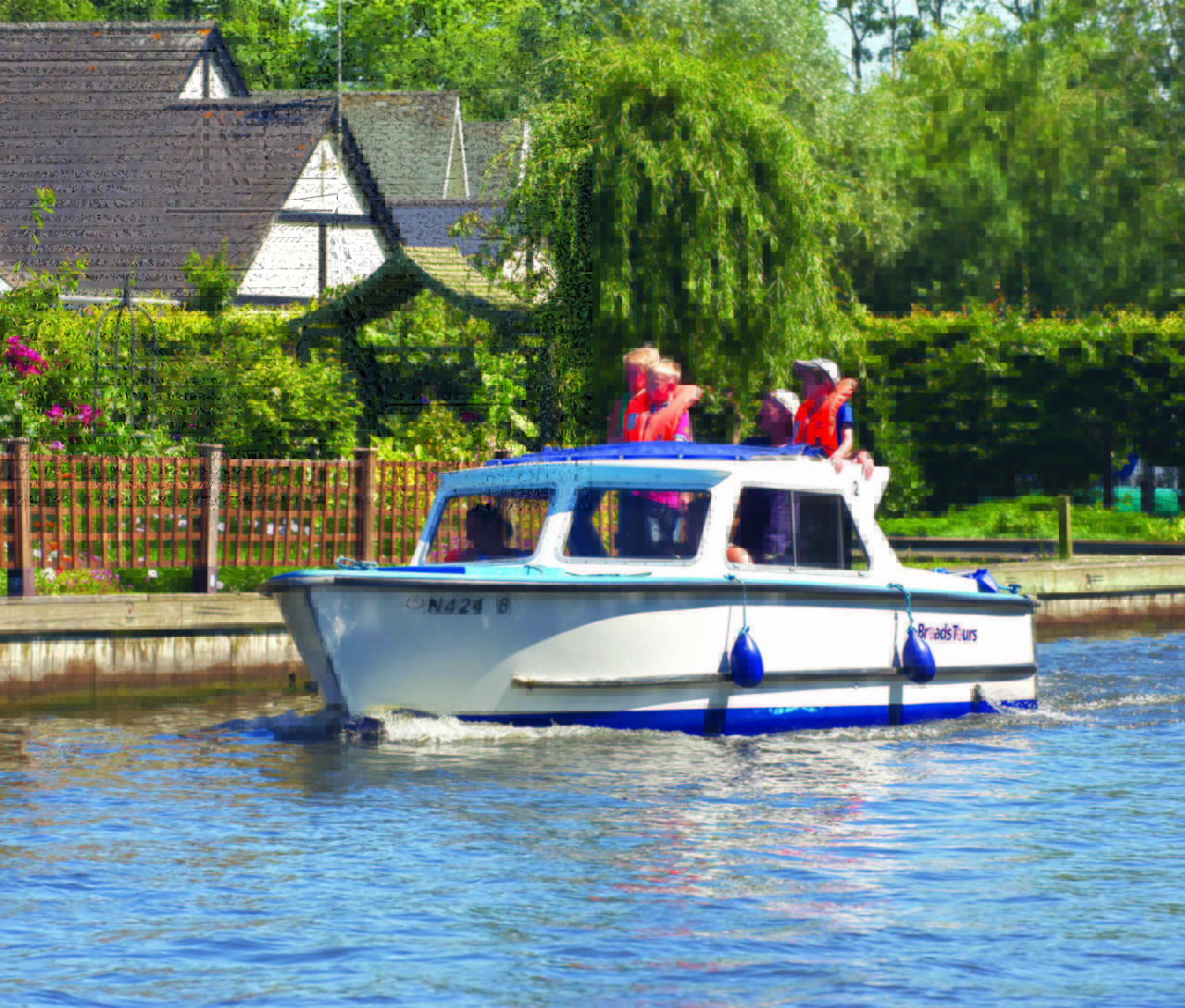 A picture of a family enjoying their day out on the Norfolk broads by day boat
