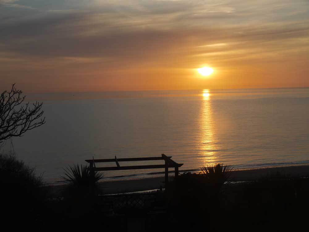 Sunset over the beaches as seen from Beachside House