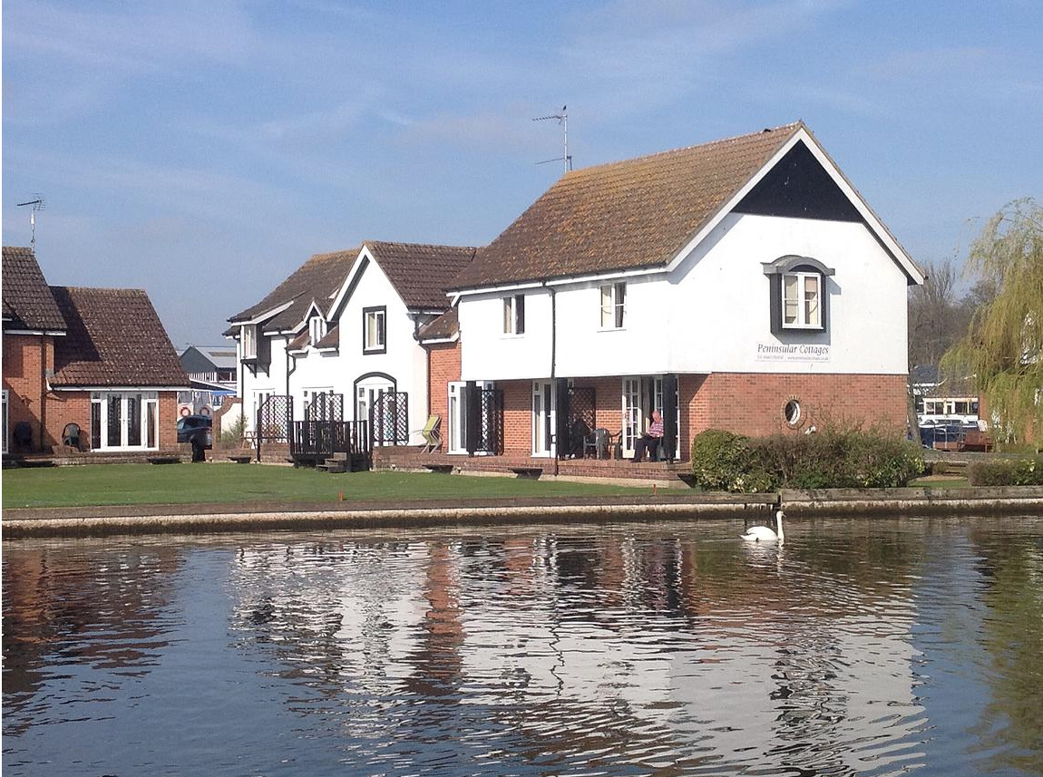 The cottage set right on the banks of the River Bure.
