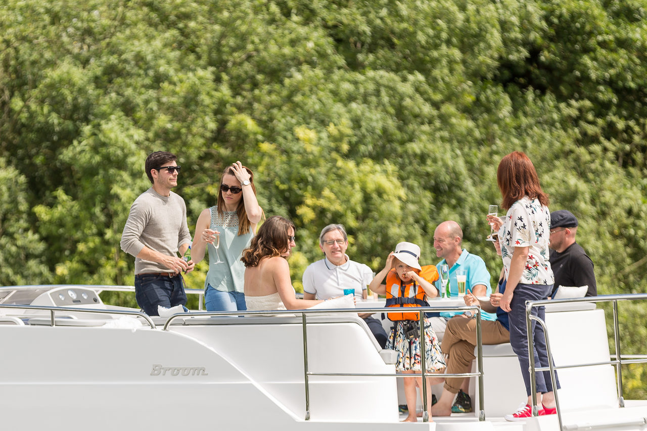 Happy customers enjoying Broom Boats