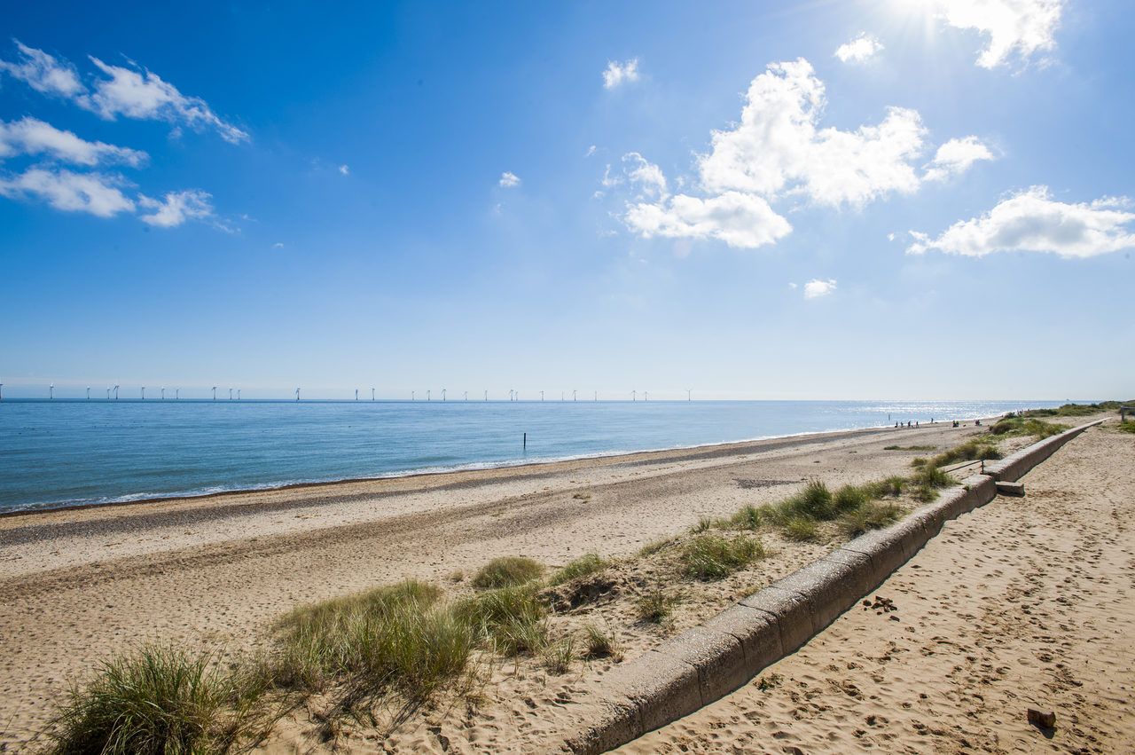 Beach With Windfarm